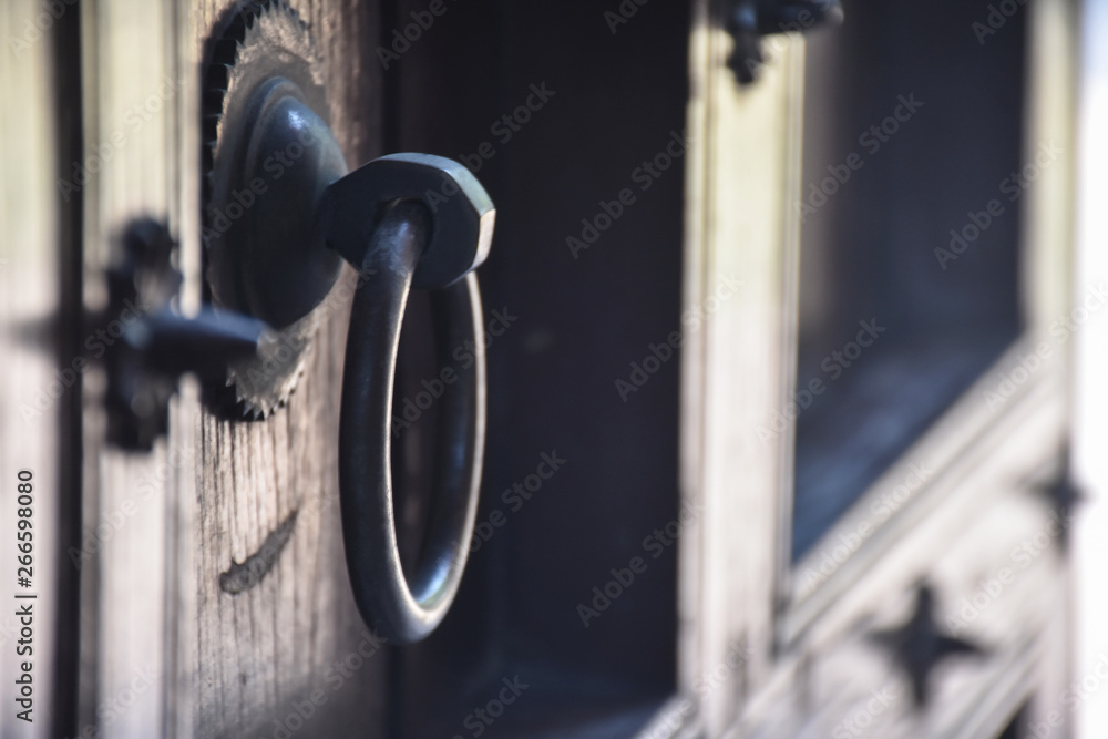 old wooden door handle on a fort in agra India old wooden door handle on a fort in agra India