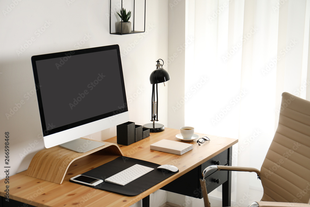 Stylish workplace interior with modern computer on table. Mockup for design Stylish workplace interior with modern computer on table. Mockup for design