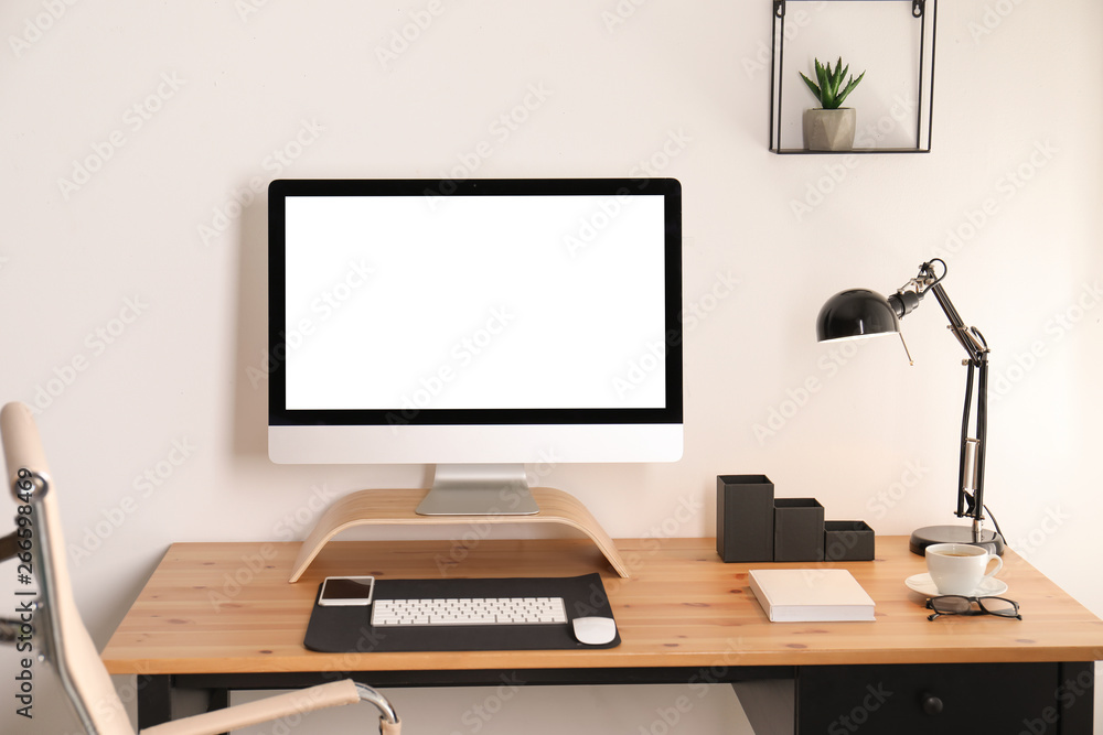 Stylish workplace interior with modern computer on table. Mockup for design Stylish workplace interior with modern computer on table. Mockup for design
