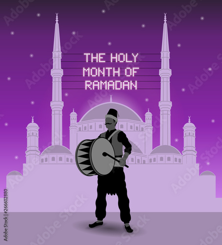 The holy month of ramadan mahya lights over a mosque with ramadan drummer