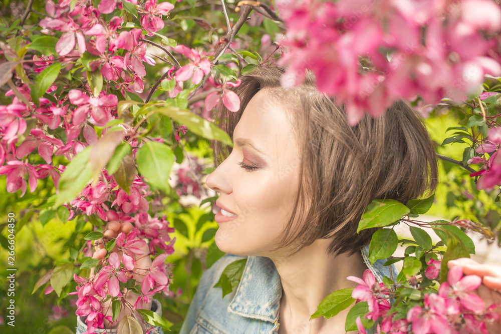 gorgeous girl in blossom spring garden enjoying and relaxing gorgeous girl in blossom spring garden enjoying and relaxing