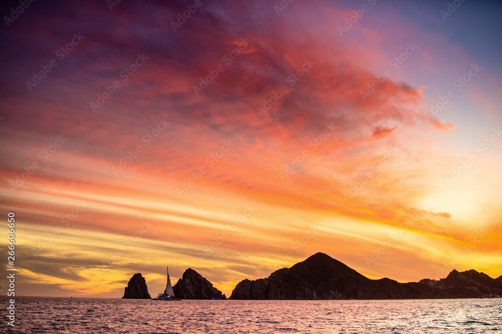 Beautiful Sunset of Seascape with Mountains silhouets. Sea off the Coast of Cabo San Lucas. Gulf of California (also known as the Sea of Cortez, Sea of Cortes. Mexico.