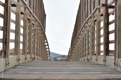 I walk through a bridge over the roads of Badalona on the way ...