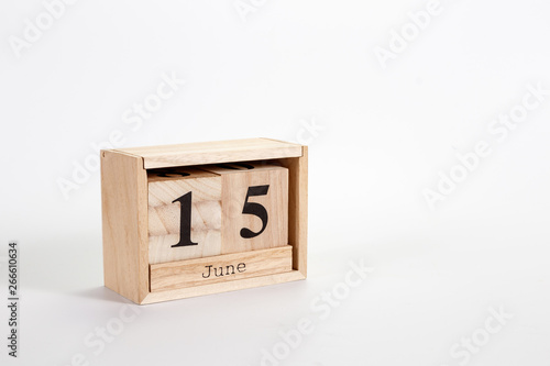 Wooden calendar June 15 on a white background