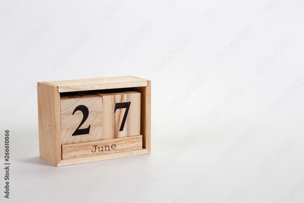 Wooden calendar June 27 on a white background Wooden calendar June 27 on a white background