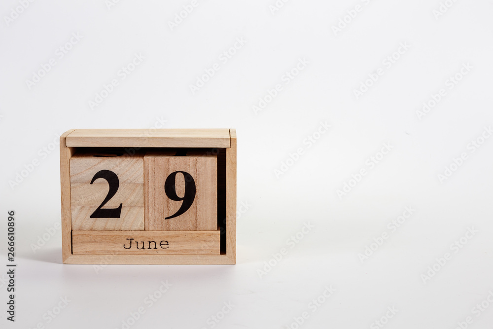 Wooden calendar June 29 on a white background Wooden calendar June 29 on a white background