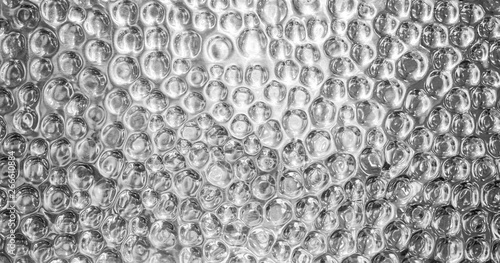 Shiny silver metal textured background with highlights and circles
