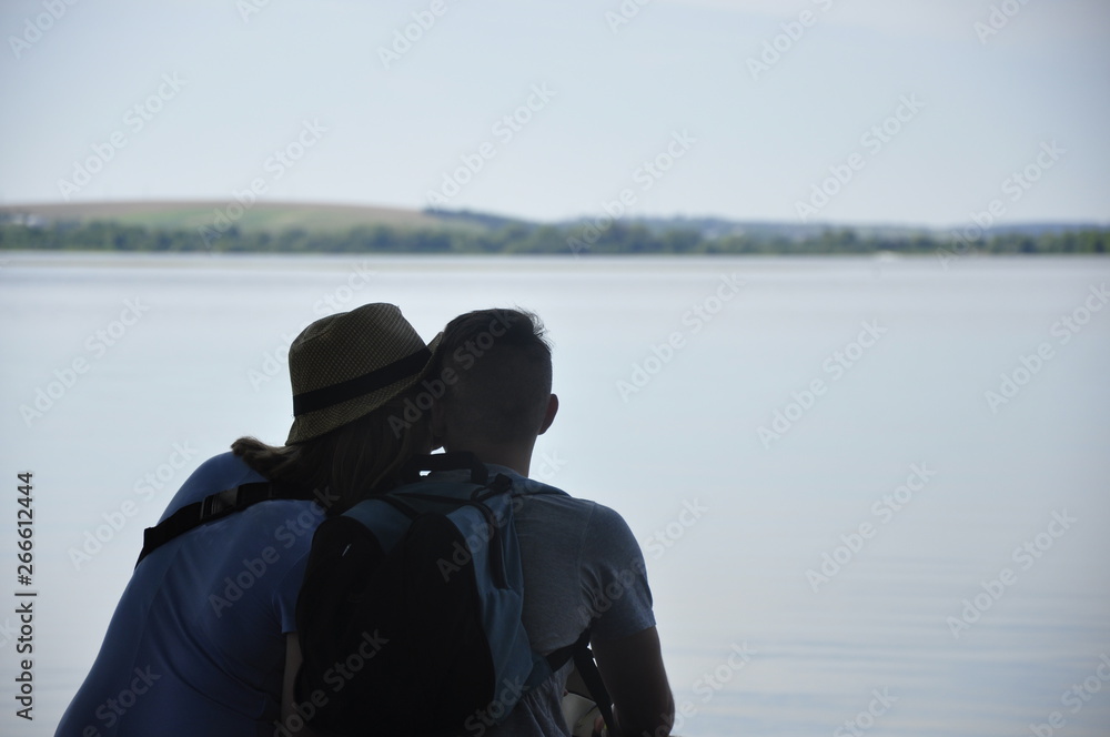 A couple of lovers on the shore of the lake A couple of lovers on the shore of the lake
