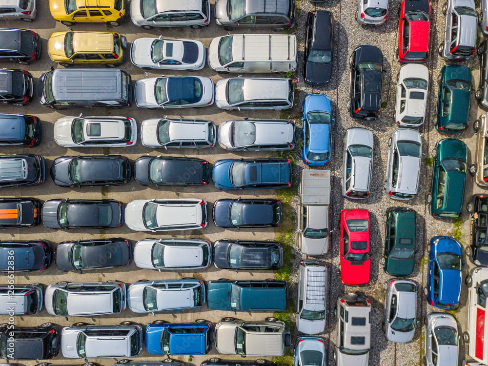 Aerial view of large car parking of car dealer. Secondhand cars.