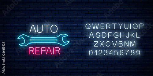 Neon auto repair shop sign with alphabet. Glowing night advertising symbol of vehicle repair station.