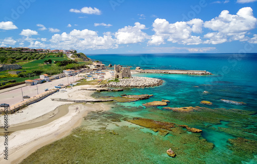Fotografie Fishing italian village Briatico in Calabria with turquoise sea and old saracen tower