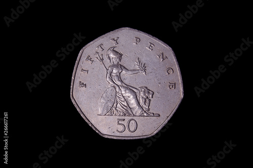 50 pence UK coin with warrior isolated on the black background photo