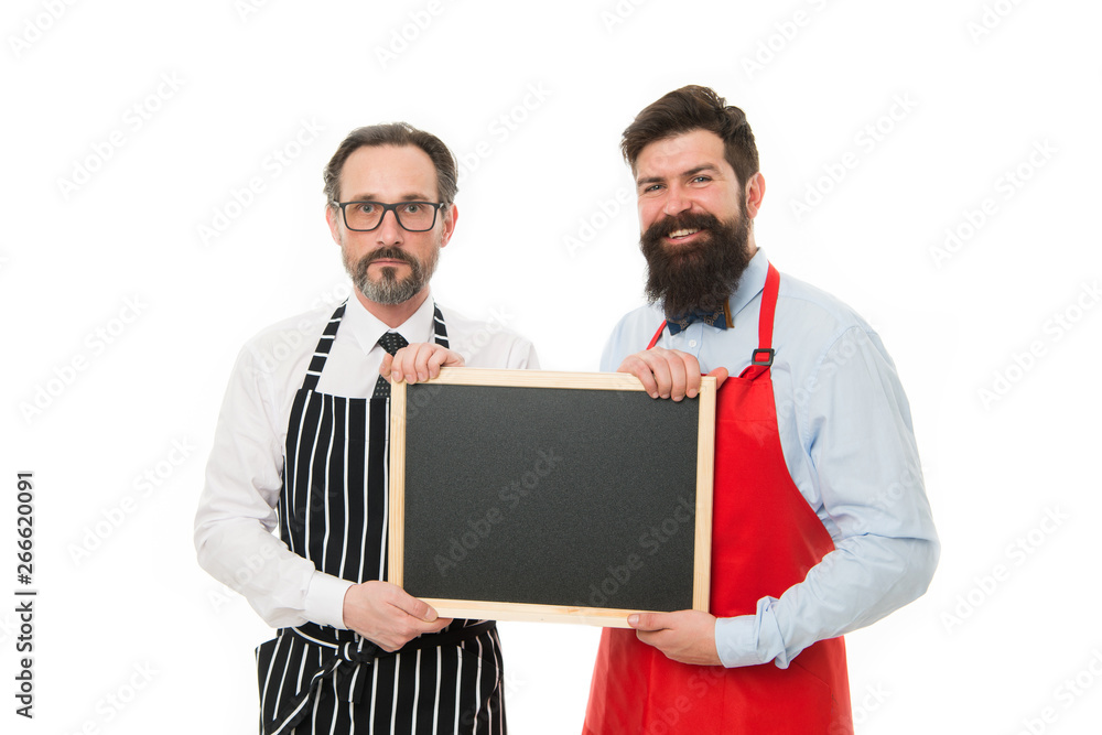 Men bearded bartender or cook in apron hold blank chalkboard. Bartender with blackboard. Hipster bartender show blackboard copy space. Bar cafe staff. Hiring staff. Men bearded hipster informing you Men bearded bartender or cook in apron hold blank chalkboard. Bartender with blackboard. Hipster bartender show blackboard copy space. Bar cafe staff. Hiring staff. Men bearded hipster informing you