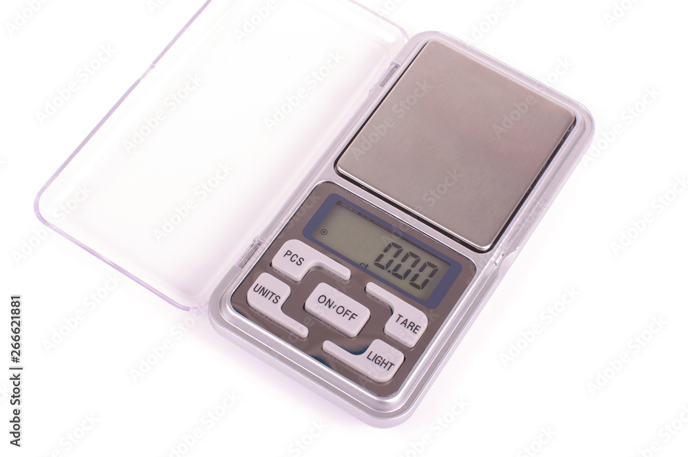 Digital high precision pocket scales isolated on the white background Digital high precision pocket scales isolated on the white background