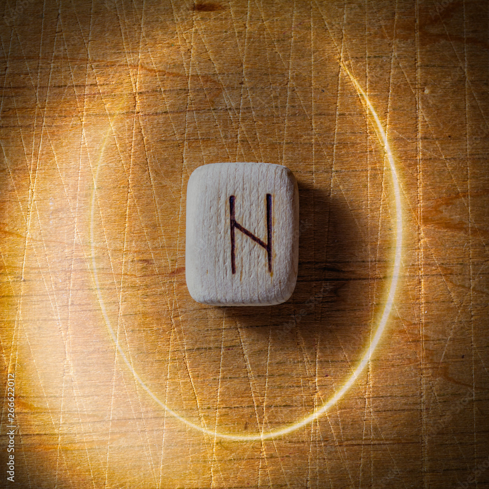 Hagalaz. Handmade scandinavian wooden runes on a wooden vintage ...