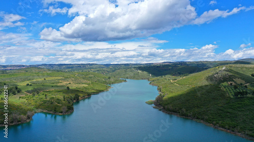 Aerial drone panoramic view of famous dam and lake of Marathon with beautiful clouds, North Attica, Greece © aerial-drone