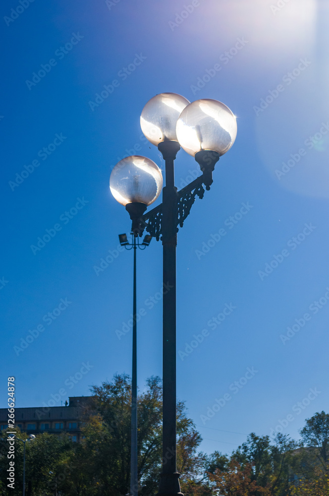 Classic style city lamppost at sunset, close up Classic style city lamppost at sunset, close up