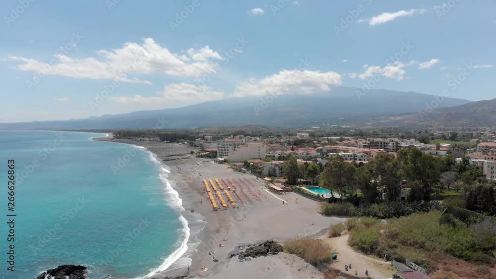 Mount Etna from Taormina beach in Sicily, Italy Mount Etna from Taormina beach in Sicily, Italy