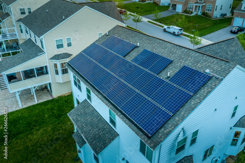 Luxury real estate house roof with solar power panels in Maryland in a new construction neighborhood for upper middle class families photo