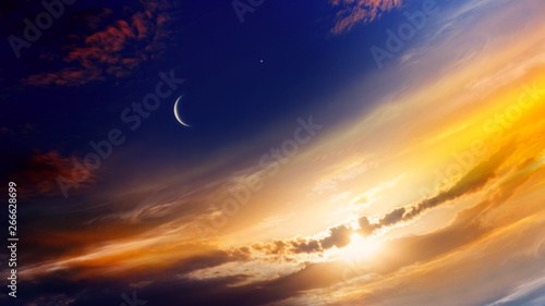 Crescent moon with beautiful sunset background . Generous Ramadan . Light from sky . Religion background . 
