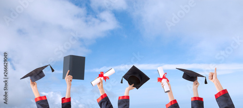 graduation ceremony  concept hat and diploma up raised hands