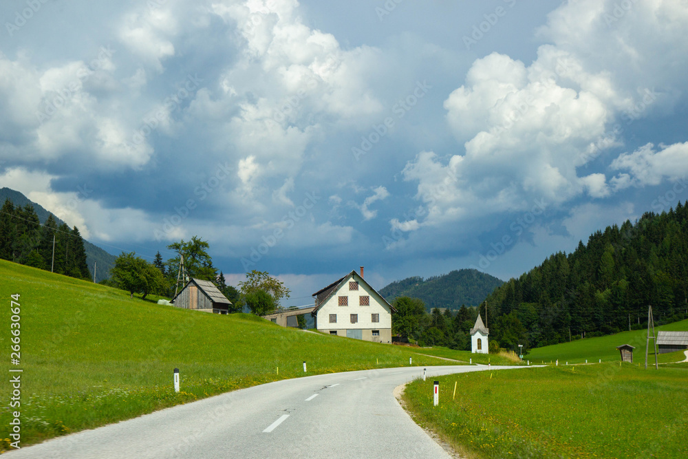 a road  through a valley in austrian Alps, Carinthia region near border with Slovenia