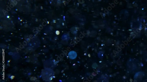 digital blue glitter background on dark