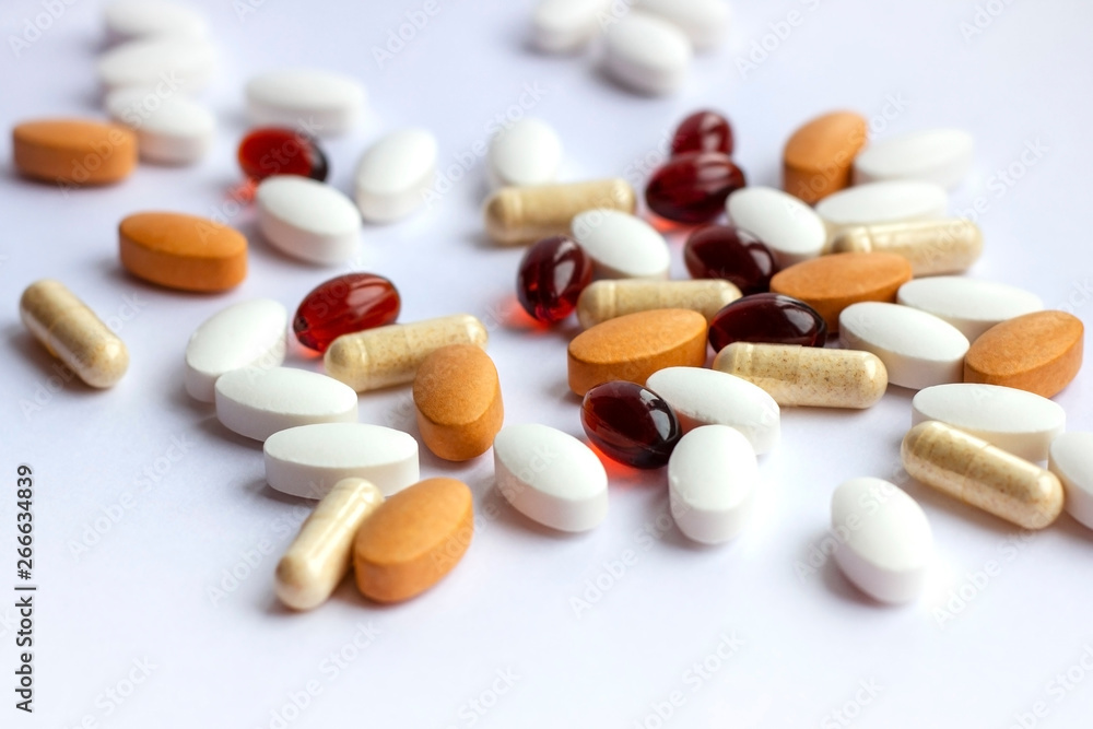 Pharmacy theme, health care, drug prescription for treatment medication and medicament. Pharmaceutical medicine pills, tablets and capsules on white background Pharmacy theme, health care, drug prescription for treatment medication and medicament. Pharmaceutical medicine pills, tablets and capsules on white background