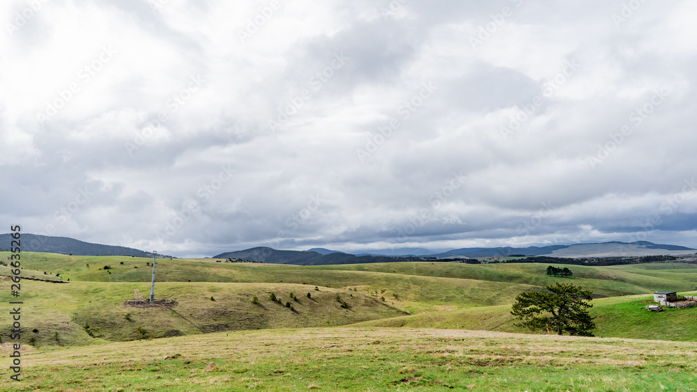 landscape with green field and blue sky landscape with green field and blue sky