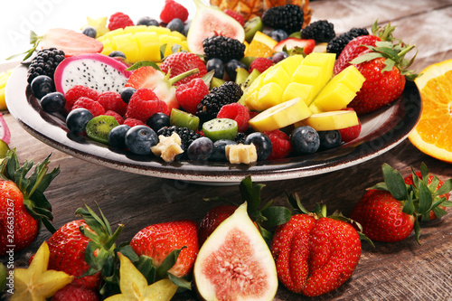 salad with fresh fruits and berries. healthy spring fruit salad with strawberries