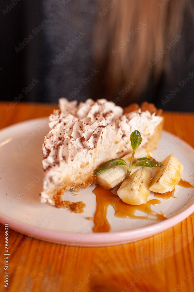Traditional banoffee pie with whipped cream and caramel sauce Traditional banoffee pie with whipped cream and caramel sauce