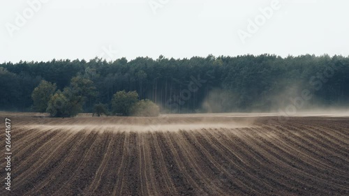 Important nutrient-rich upper layers of agricultural soil being blown away by strong winds in northern Germany. photo