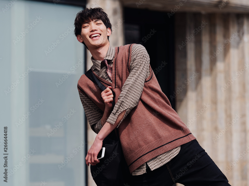 Portrait of a handsome Chinese young man exciting and smiling at you. Portrait of a handsome Chinese young man exciting and smiling at you.