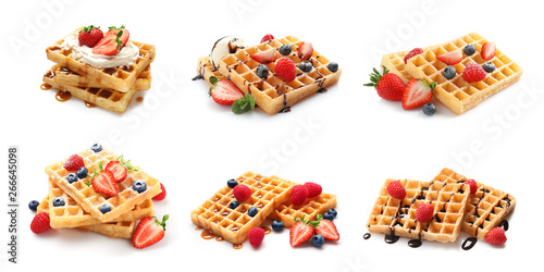 Set of delicious waffles with different toppings on white background