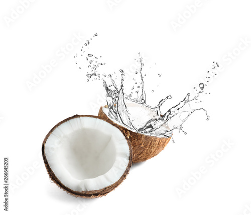 Vászonkép Halves of coconut on white background
