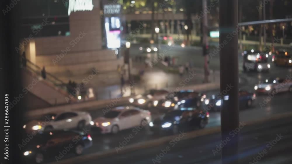Slow motion shot inside of a transparent elevator of the streets of Las Vegas, Nevada, United States, during night time. Slow motion shot inside of a transparent elevator of the streets of Las Vegas, Nevada, United States, during night time.