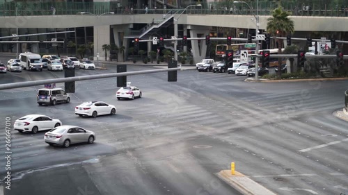 Street lights and the traffic in a car crossing of Las Vegas, Nevada, United States in slow motion.