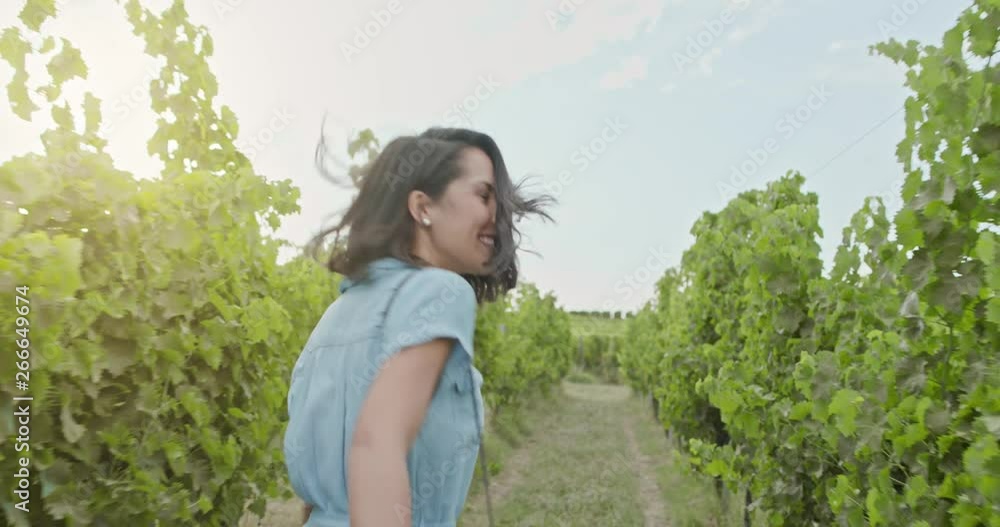 Romantic love couple, woman smiling running and walking near vineyard at sunset or sunrise.Warm sun back light.Following POV point of view.Friends italian trip in Umbria.4k slow motion Romantic love couple, woman smiling running and walking near vineyard at sunset or sunrise.Warm sun back light.Following POV point of view.Friends italian trip in Umbria.4k slow motion