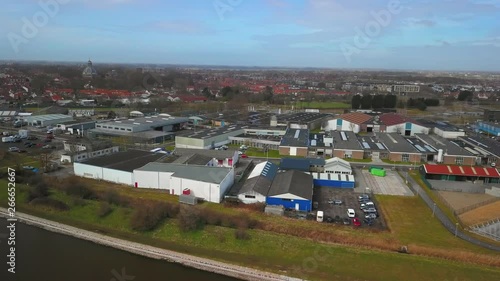 The historical city of Middelburg with in the foreground a canal and industrial area. Aerial shot. photo