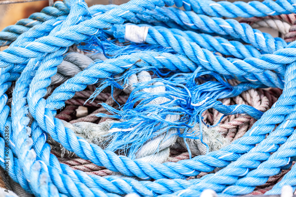 Vivid blue thick mooring rope extreme closeup