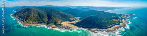 Famous Great Ocean Road passing through breathtaking coastline - aerial panoramic landscape