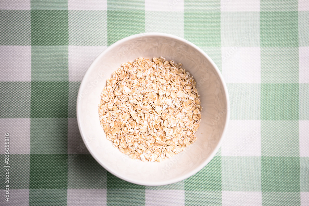 Healthy breakfast cereal oat flakes in bowl Healthy breakfast cereal oat flakes in bowl