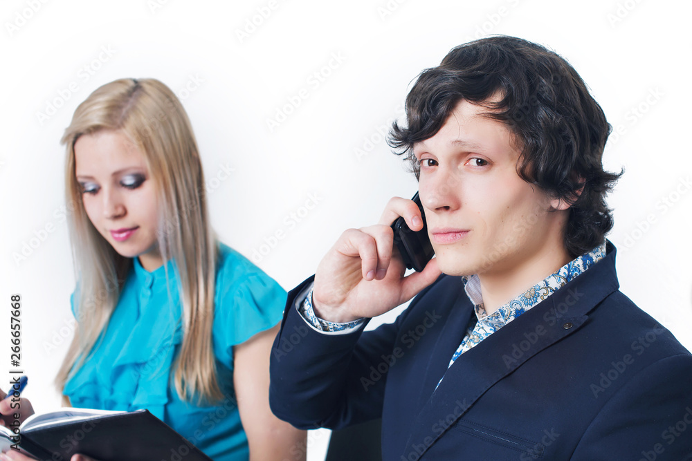 portrait of 2 businessmen on a white background. A man talking on the phone, a woman writes in a notebook portrait of 2 businessmen on a white background. A man talking on the phone, a woman writes in a notebook