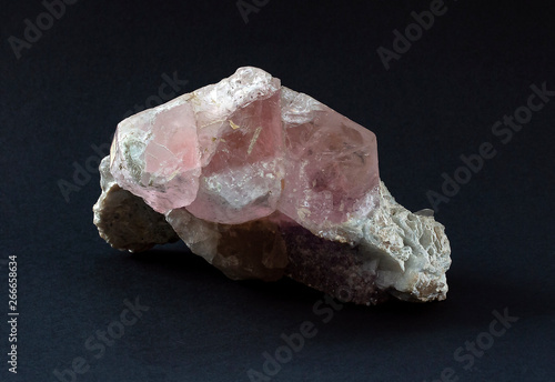 Piece of Morganite mineral a gem-quality beryl colored pink or rose-lilac by the presence of cesium. Crystal from Pakistan composed of beryllium aluminium cyclosilicate. photo