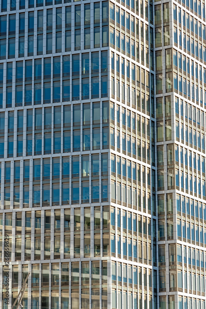 Glass facade of a modern office building seen in Hamburg, Germany