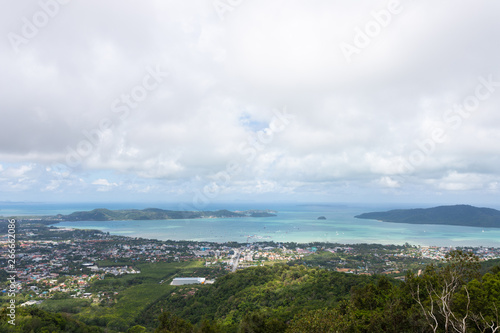 Phuket city scape from high hill ground, can see both town and the beach with cloudy sky