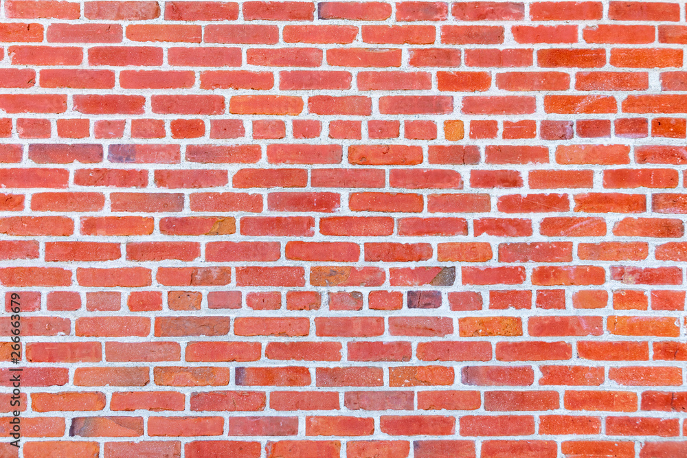 Obraz premium Red brick wall with red blocks. Brick wall texture background.