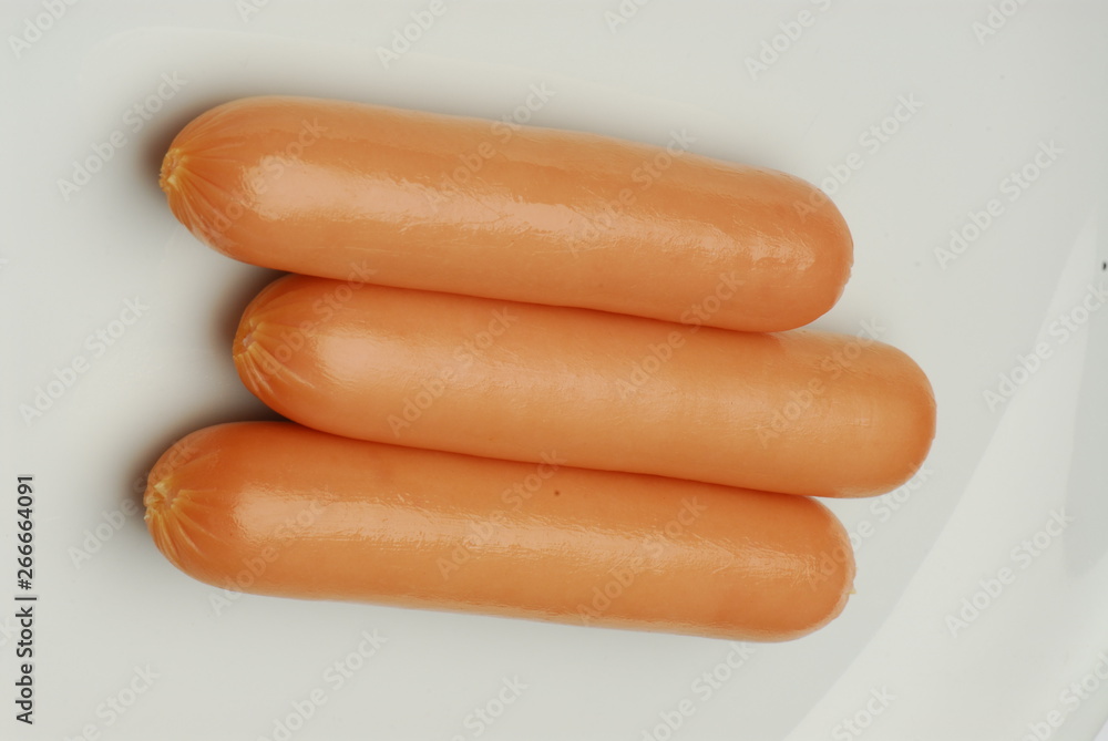 Three frankfurter on an isolated gray background Three frankfurter on an isolated gray background