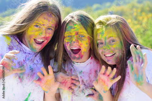 Emotional girls with happy mood with colorful dry colors. children with creative body art. Crazy hipster girls. Happy youth party. Optimist. Spring. colorful neon paint makeup. positive and cheerful
