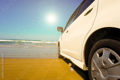 Car facing the sea on the beach. ビーチで海と向かい合う自動車 © Kana Design Image